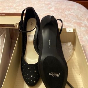 Black ankle strap heels with embellishments